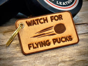 Watch For Flying Pucks Keychain